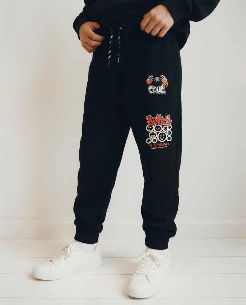 Jogger in cotone con tasche e coulisse - Nero