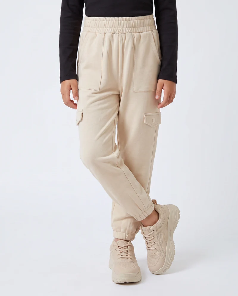 Jogger bambina comodi con tasconi e vita elastica - Beige