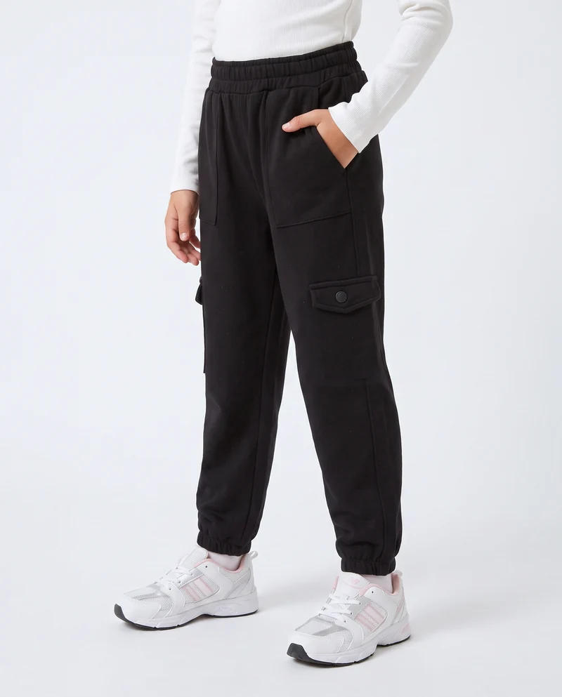 Jogger bambina comodi con tasconi e vita elastica - Nero