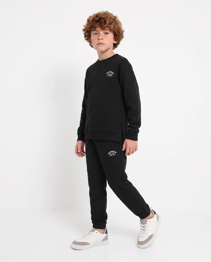 Felpa girocollo minimal con stampa e spacchetti - Nero