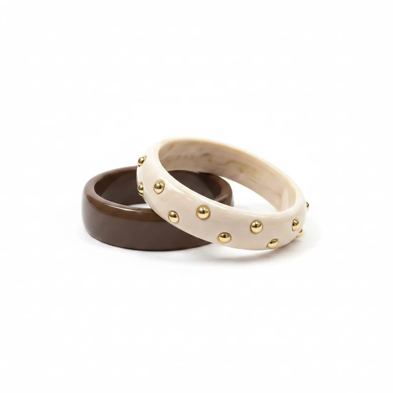 Bracciali rigidi in plastica con borchie - Moro