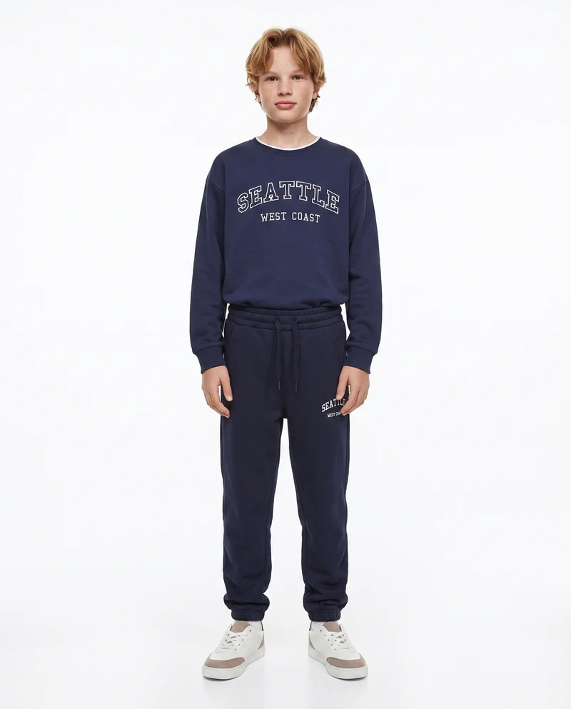 Jogger college con ricamo e tasche - Blu