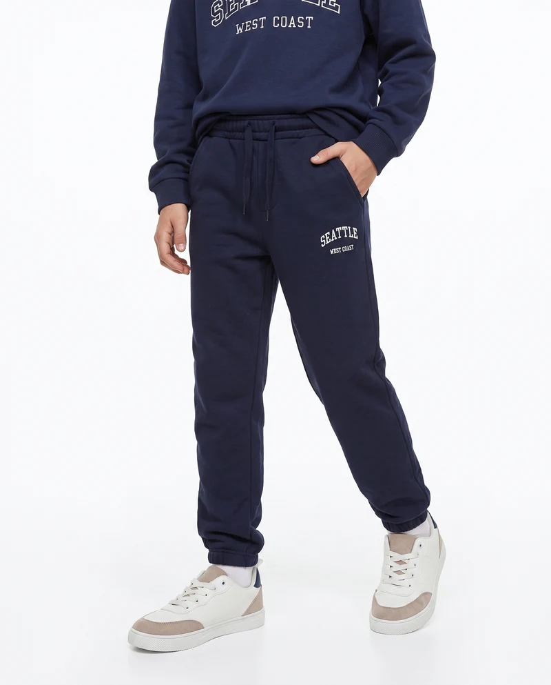 Jogger college con ricamo e tasche - Blu