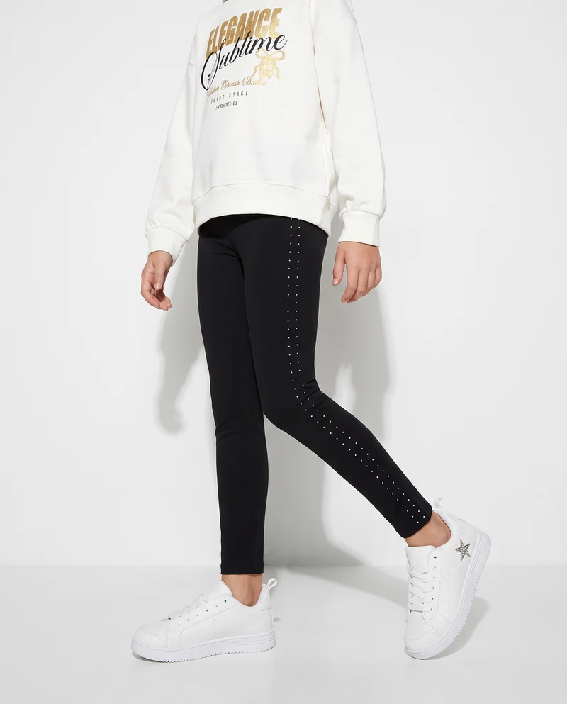 Leggings in interlock con borchie laterali - Nero
