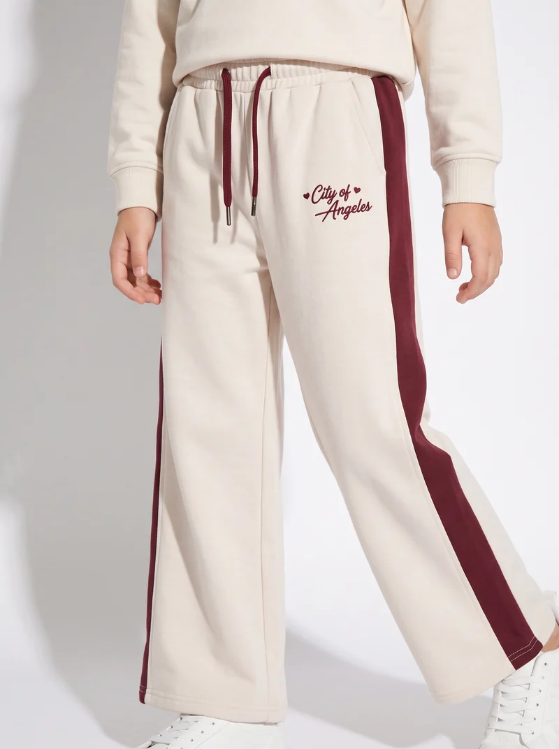 Jogger gamba dritta con bande a contrasto - Bianco burro