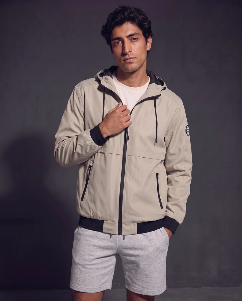 Giubbotto antivento con cappuccio regolabile - Beige