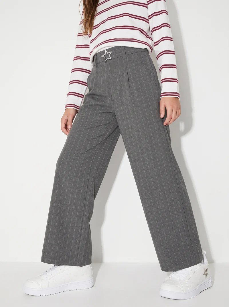 Pantalone gamba ampia con cintura gioiello - Righe