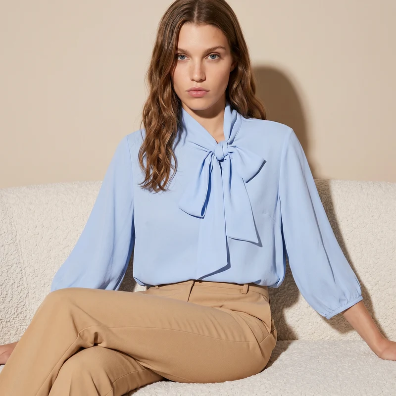 Blusa cropped con fiocco e maniche 3/4 - Celeste
