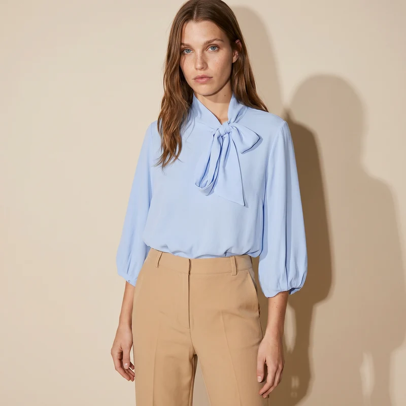 Blusa cropped con fiocco e maniche 3/4 - Celeste