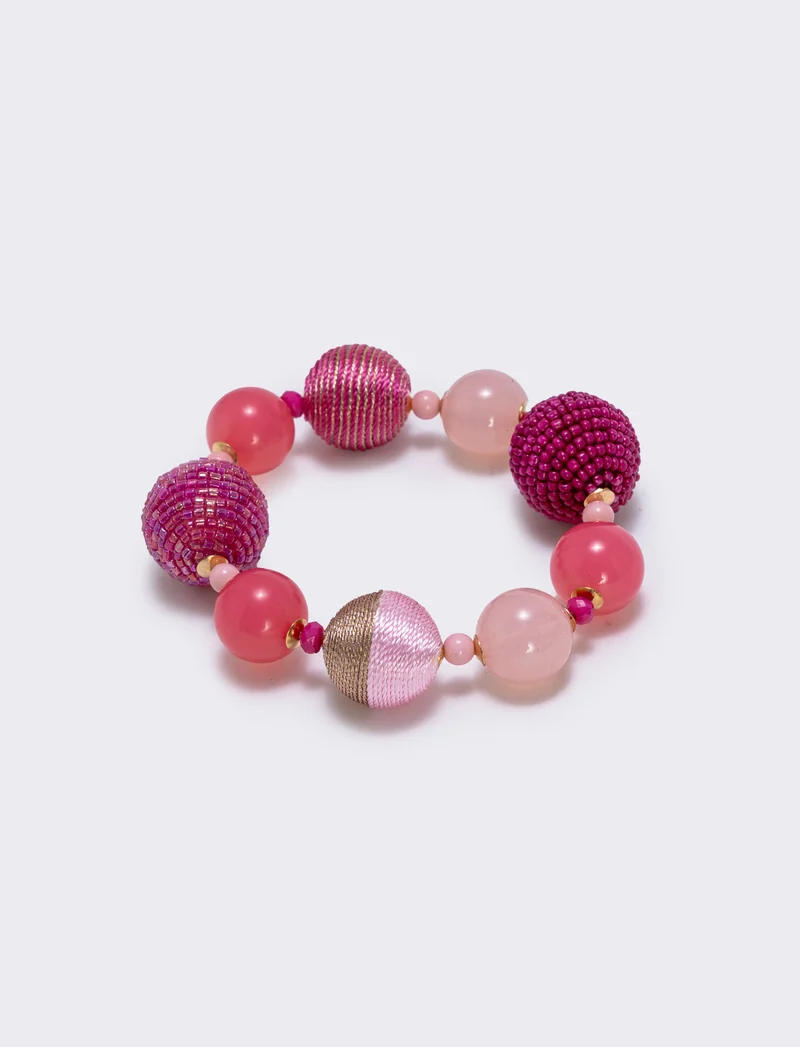 Bracciale elastico con sfere di conteria - Fuxia