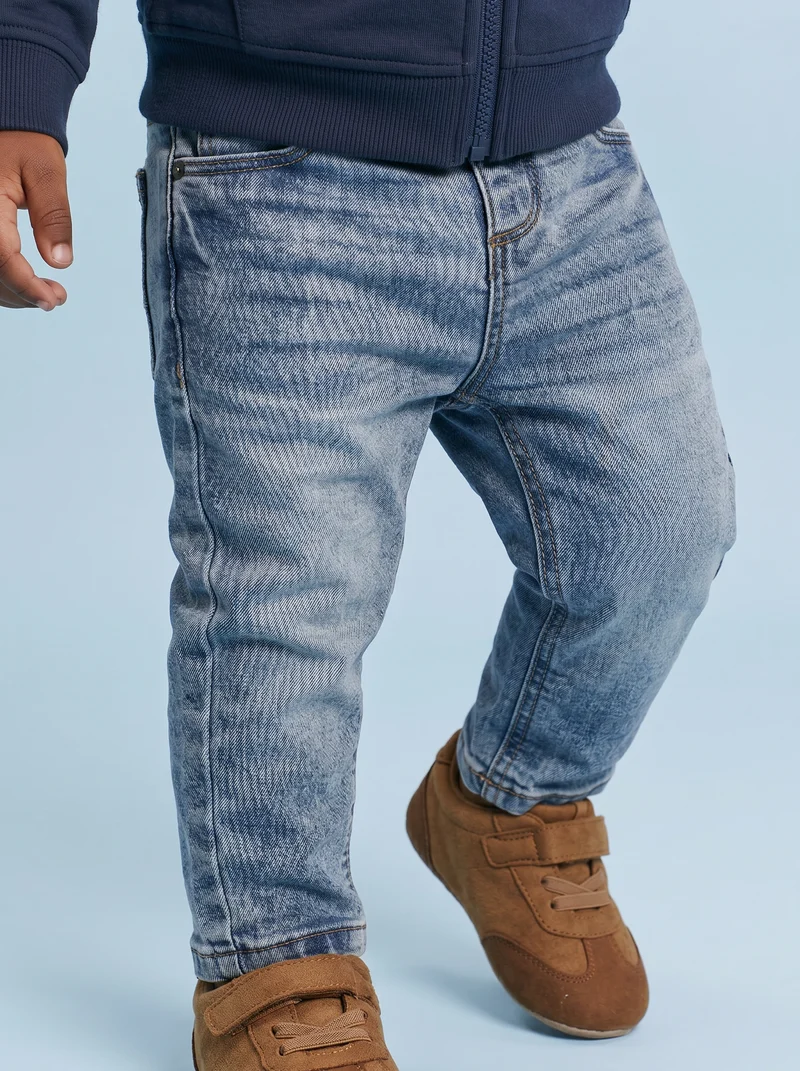 Jeans straight in denim elastico rotti - Denim chiaro