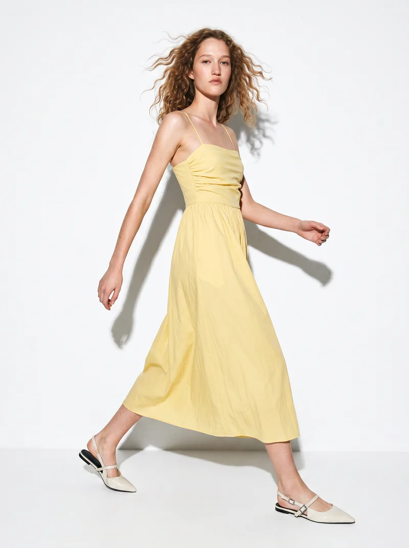 Vestito lungo con corpetto a costine e tasche - Giallo pastello