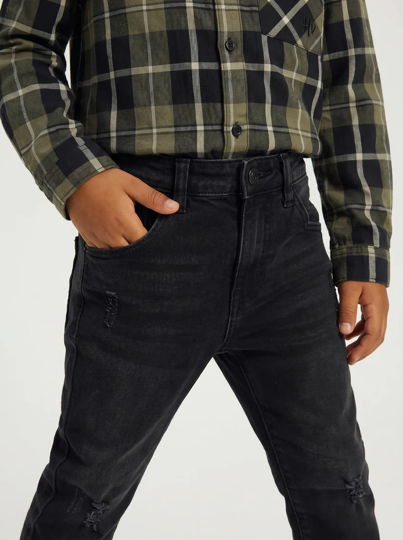 Jeans 5 tasche con rotture e patch - Nero