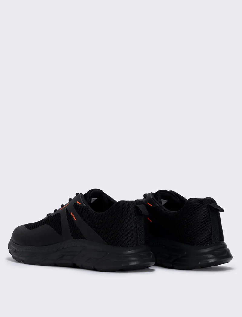 Scarpa sportiva nera in tessuto tecnico - Nero