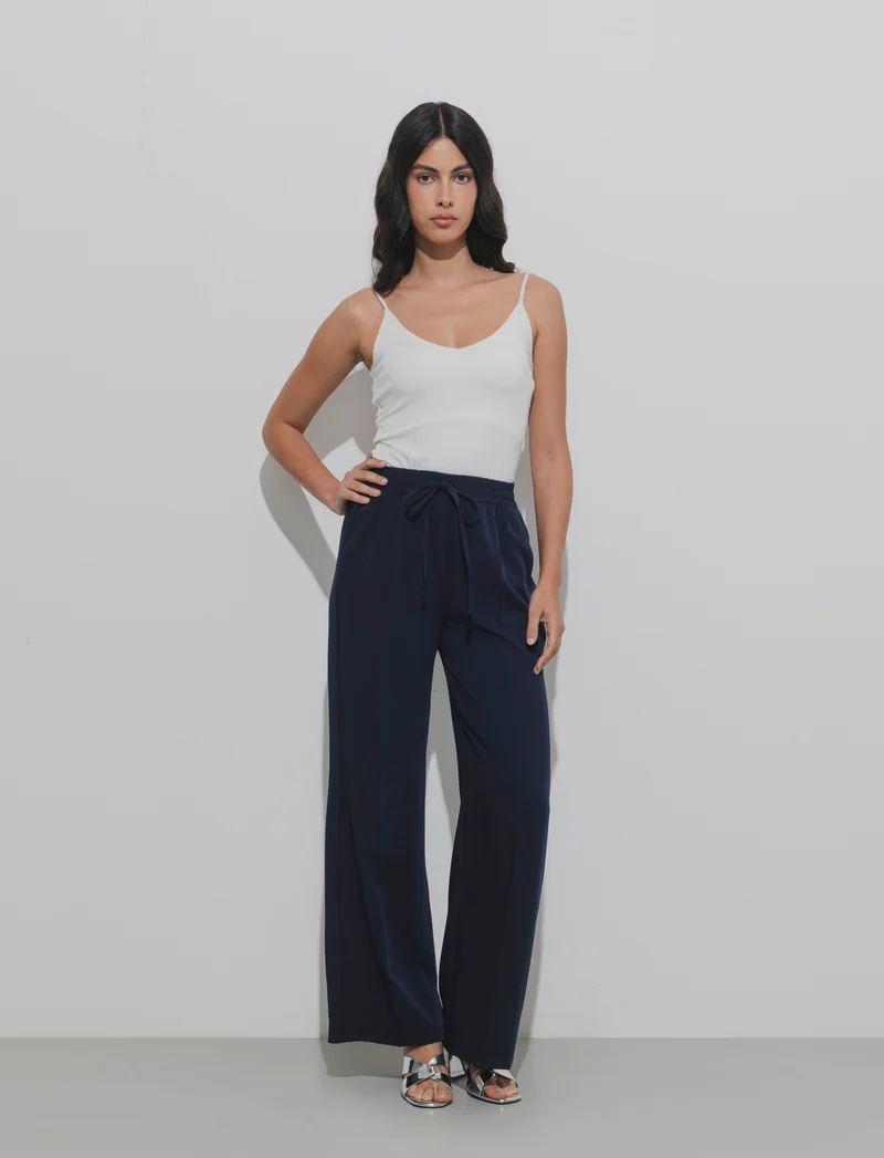 Pantalone palazzo con vita elasticizzata e coulisse regolabile. - Blu
