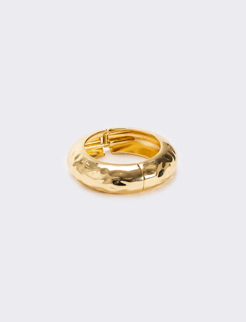 Bracciale rigido martellato chiusura a scatto - Oro