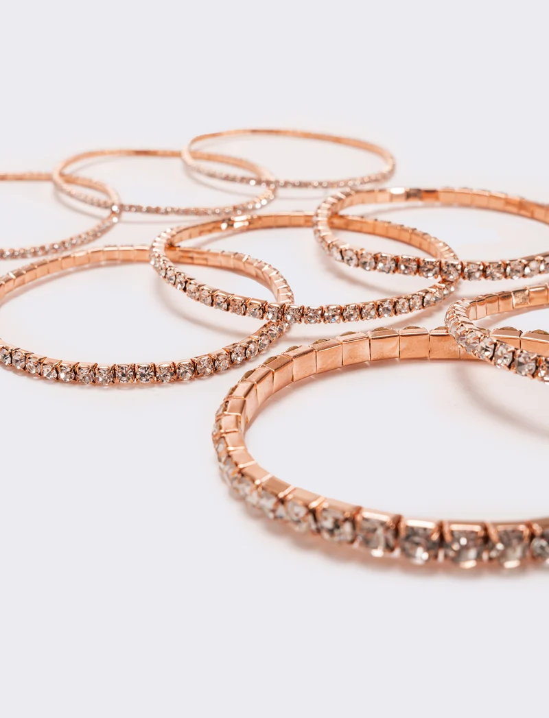 8 bracciali elastici con strass - Oro rosa