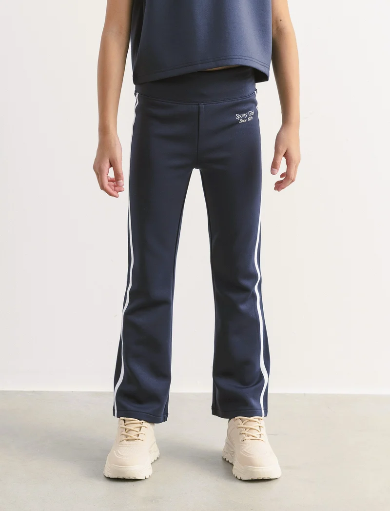 Leggings in tessuto tecnico con profili a contrasto. - Blu