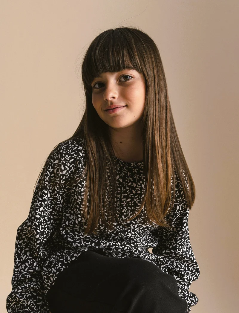 Blusa stampata da bambina. - Nero