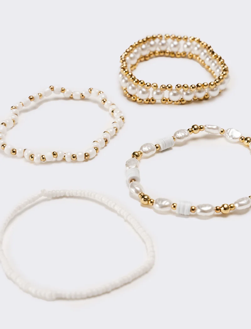 Bracciale donna 4 fili elastici - Oro