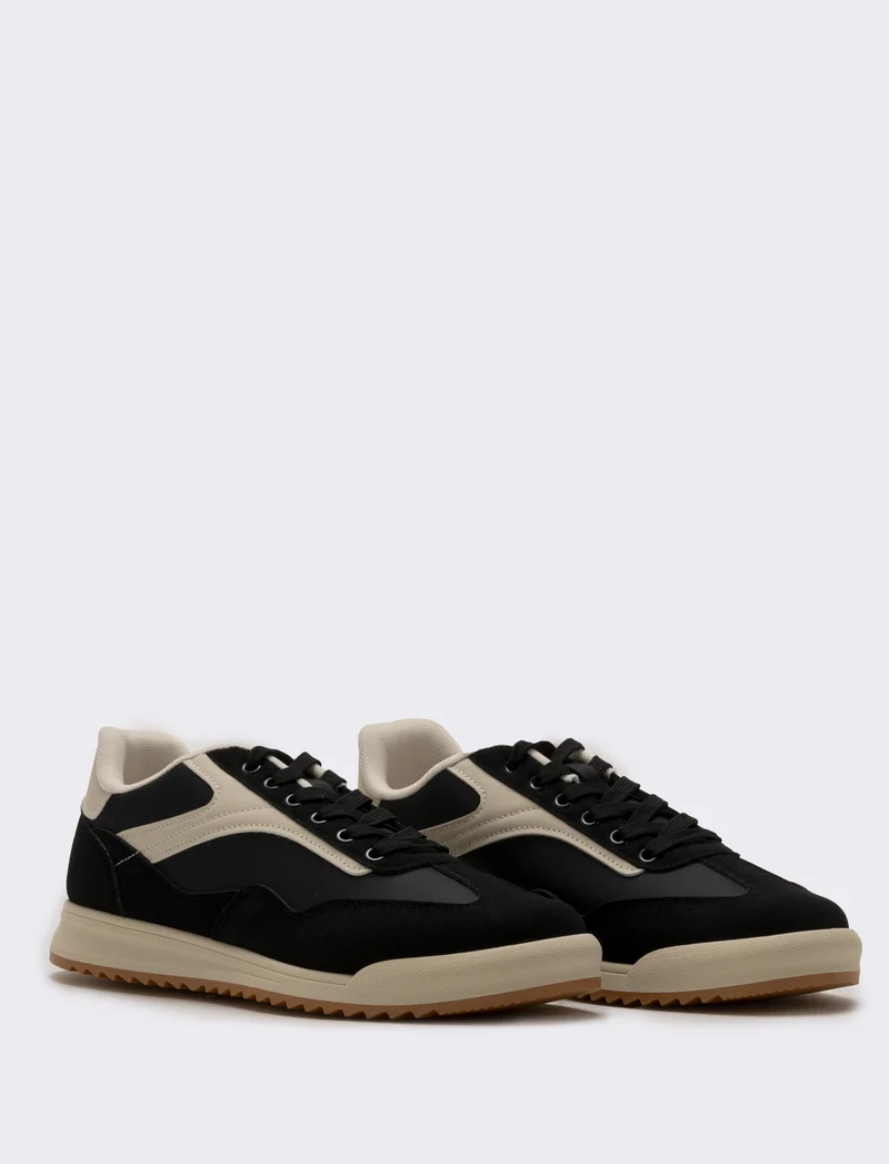 Sneakers nere in poliuretano con dettagli bianchi - Nero