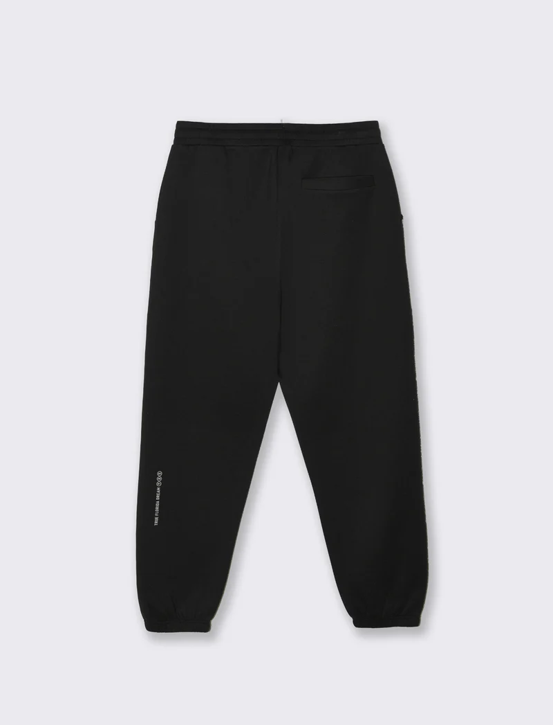 Pantaloni jogger in interlock con tasche - Nero