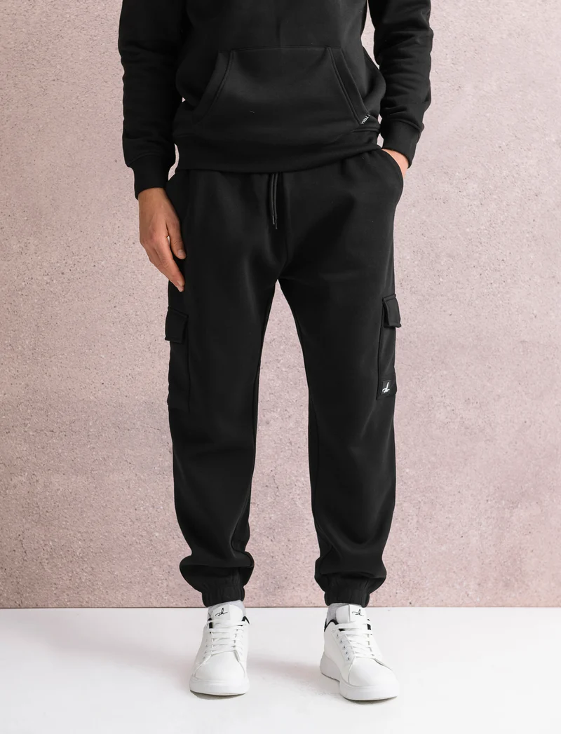 PANTALONI IN FELPA CON TASCONI - Nero