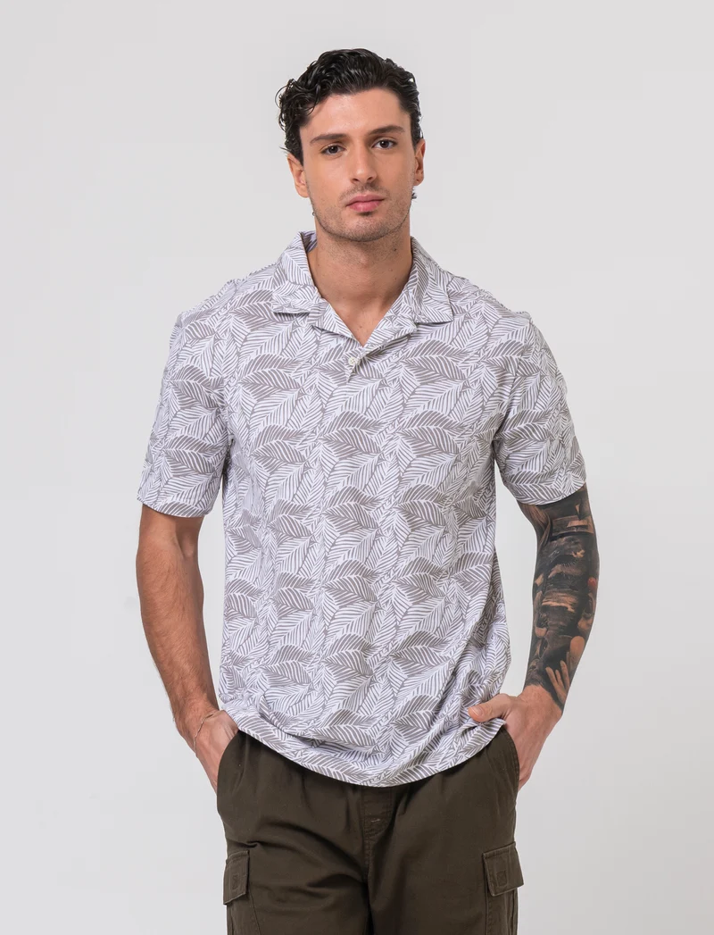 Polo in piquet all over print da uomo - Bianco